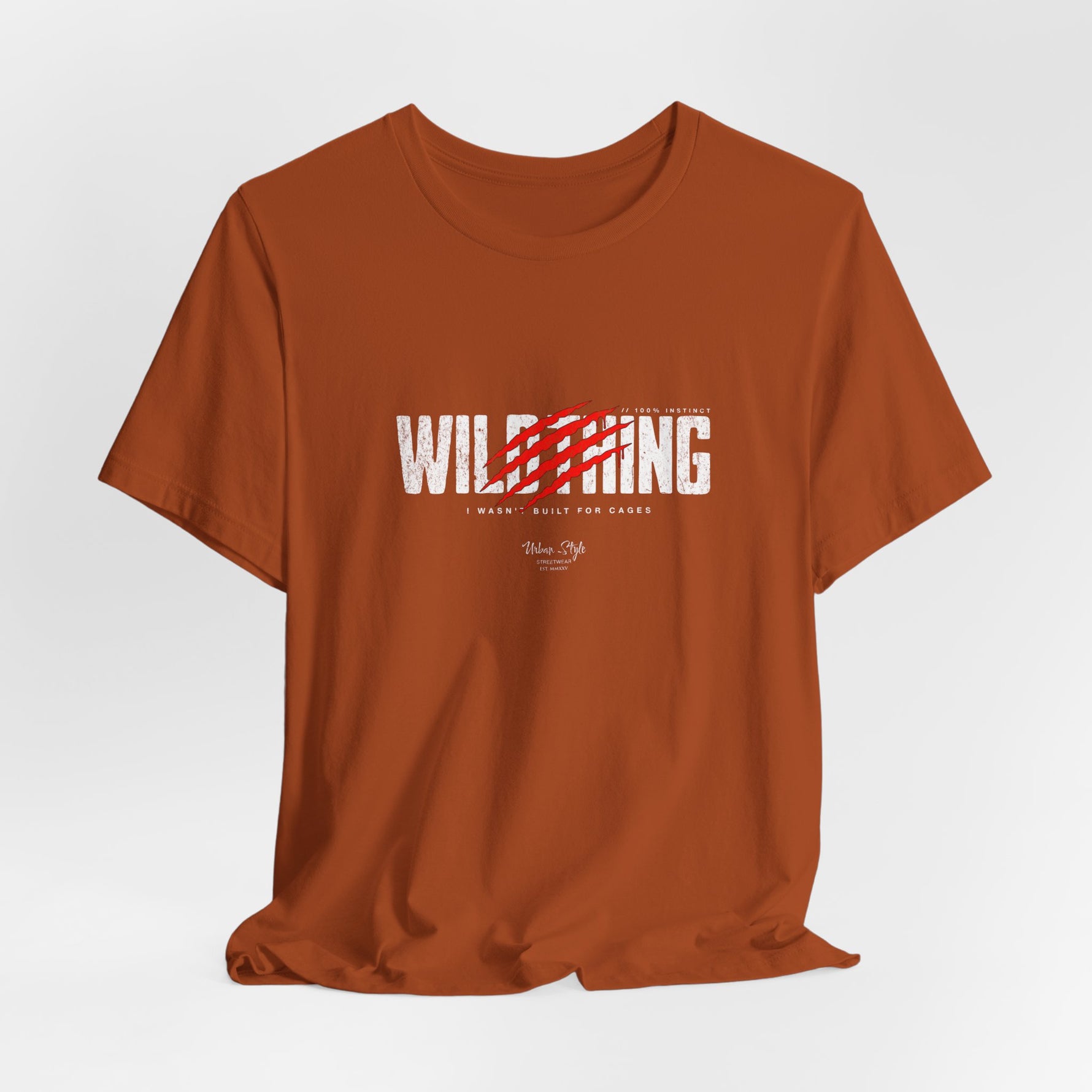 The WILDTHING t-shirt in Autumn — Off-orange tone that brings out the feral energy of the red claw mark.
