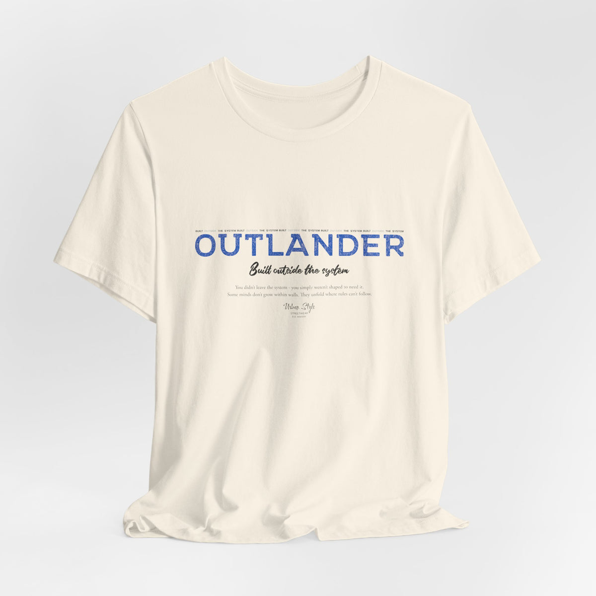 The OUTLANDER t-shirt in Natural — raw and honest, like the outsiders who stay real.