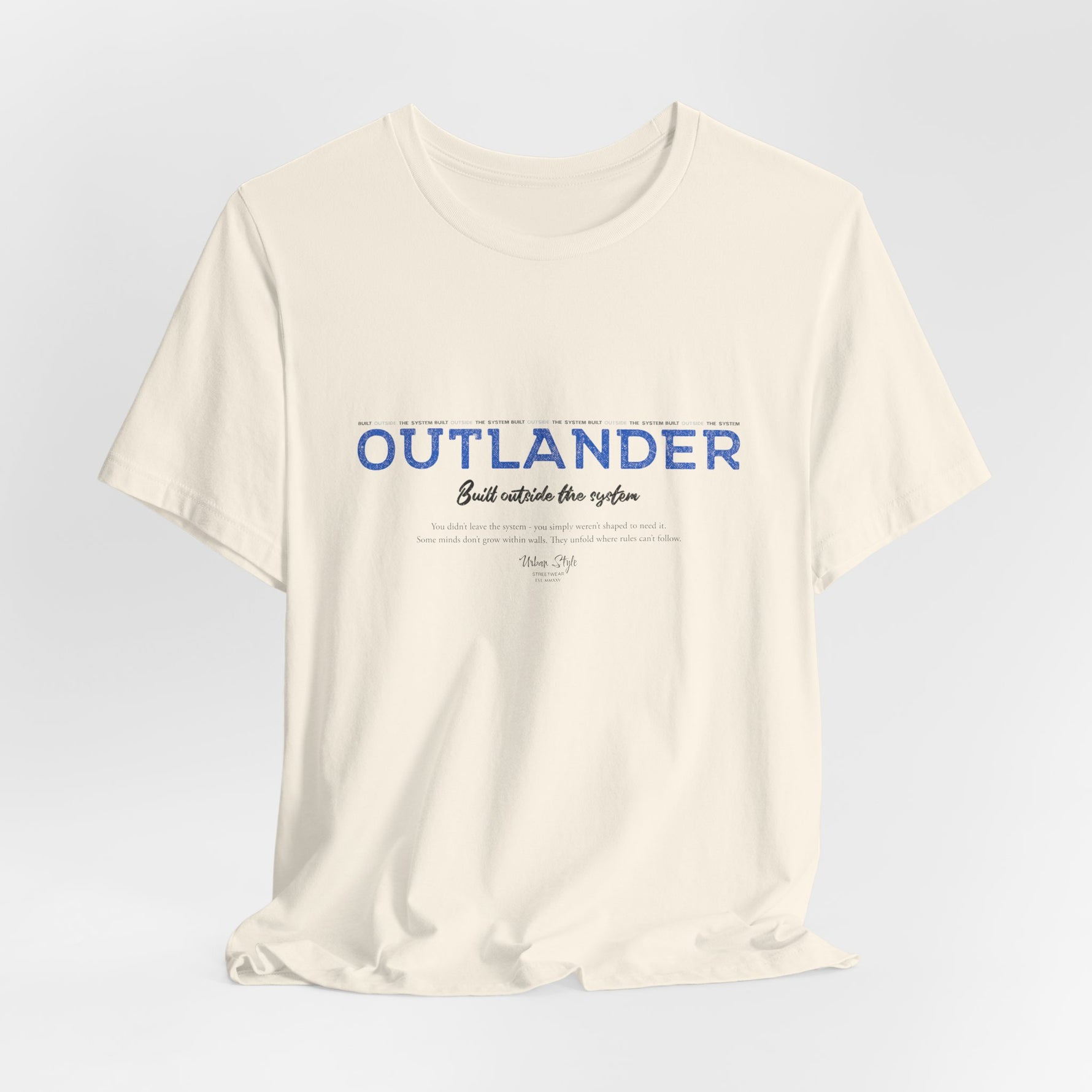 The OUTLANDER t-shirt in Natural — raw and honest, like the outsiders who stay real.