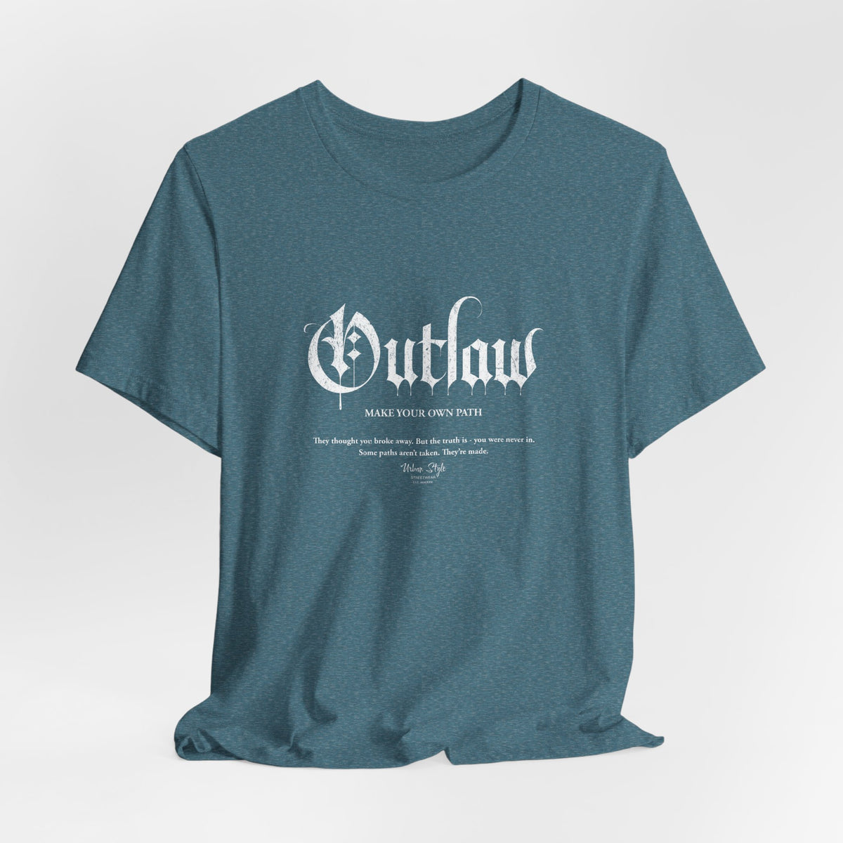The OUTLAW t-shirt in Heather Deep Teal — cold current, steady course, off the grid.