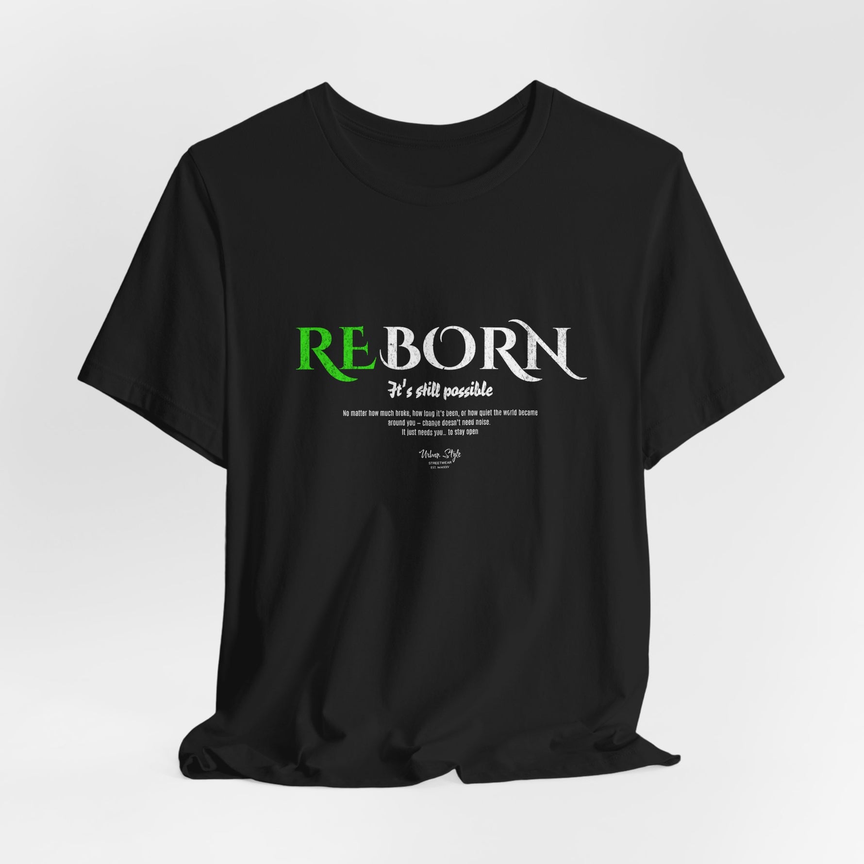 The REBORN t-shirt in Black — transformation hidden in shadow, rising with purpose.
