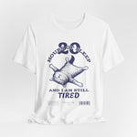 3D mockup of the “STILL TIRED” t-shirt in White — clean bright tone with no background or model.