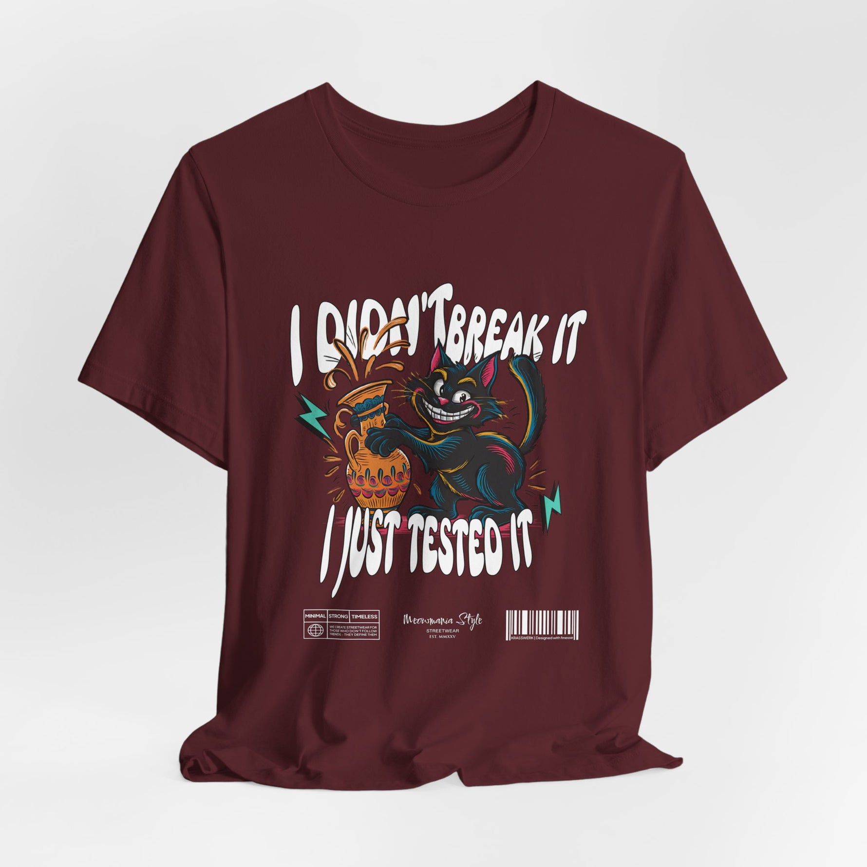 The I Just Tested It t-shirt in maroon — a rich, deep burgundy that gives the rebellious cat a bold, moody backdrop.