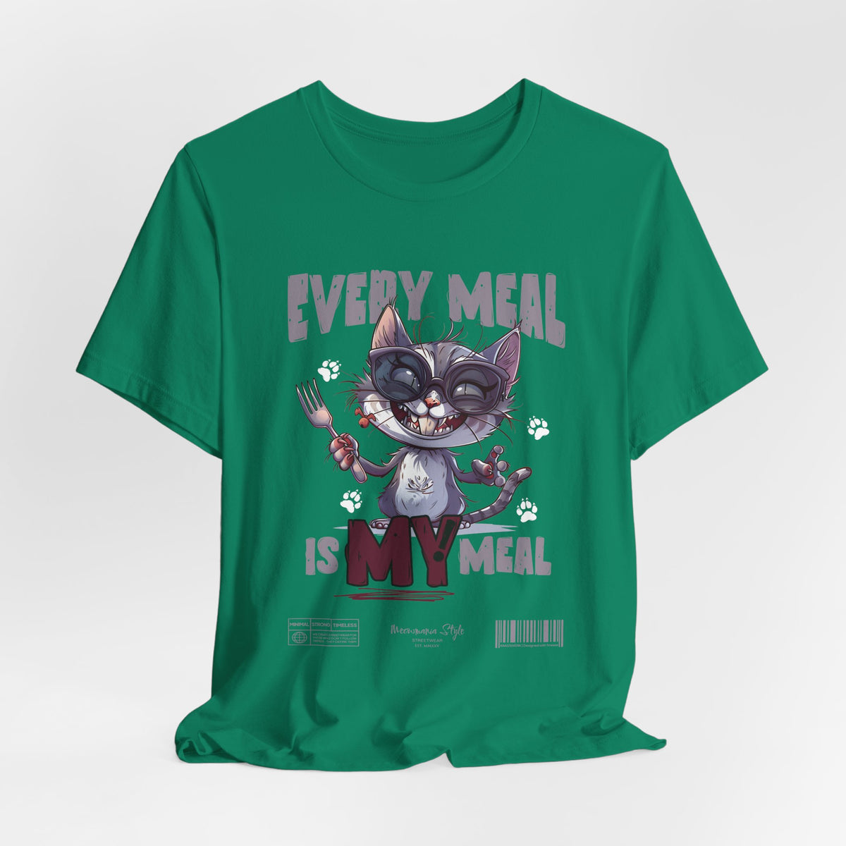 The EVERY MEAL IS MY MEAL t-shirt in kelly — a vibrant green that adds quirky contrast to the cat’s expression.