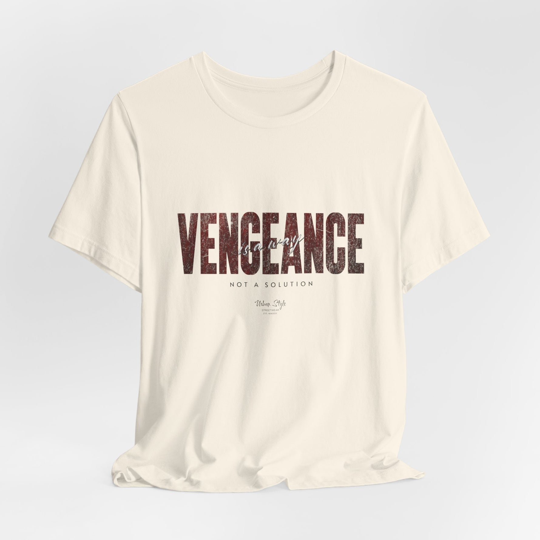 The VENGEANCE t-shirt in Natural — understated but unsettling, as if something’s off.