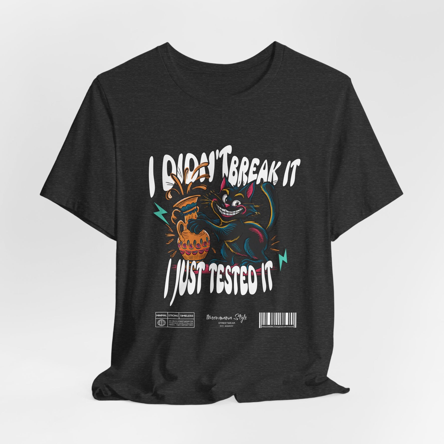 The I Just Tested It t-shirt in dark heather grey — a textured charcoal tone that balances the vibrant artwork with subtle edge.