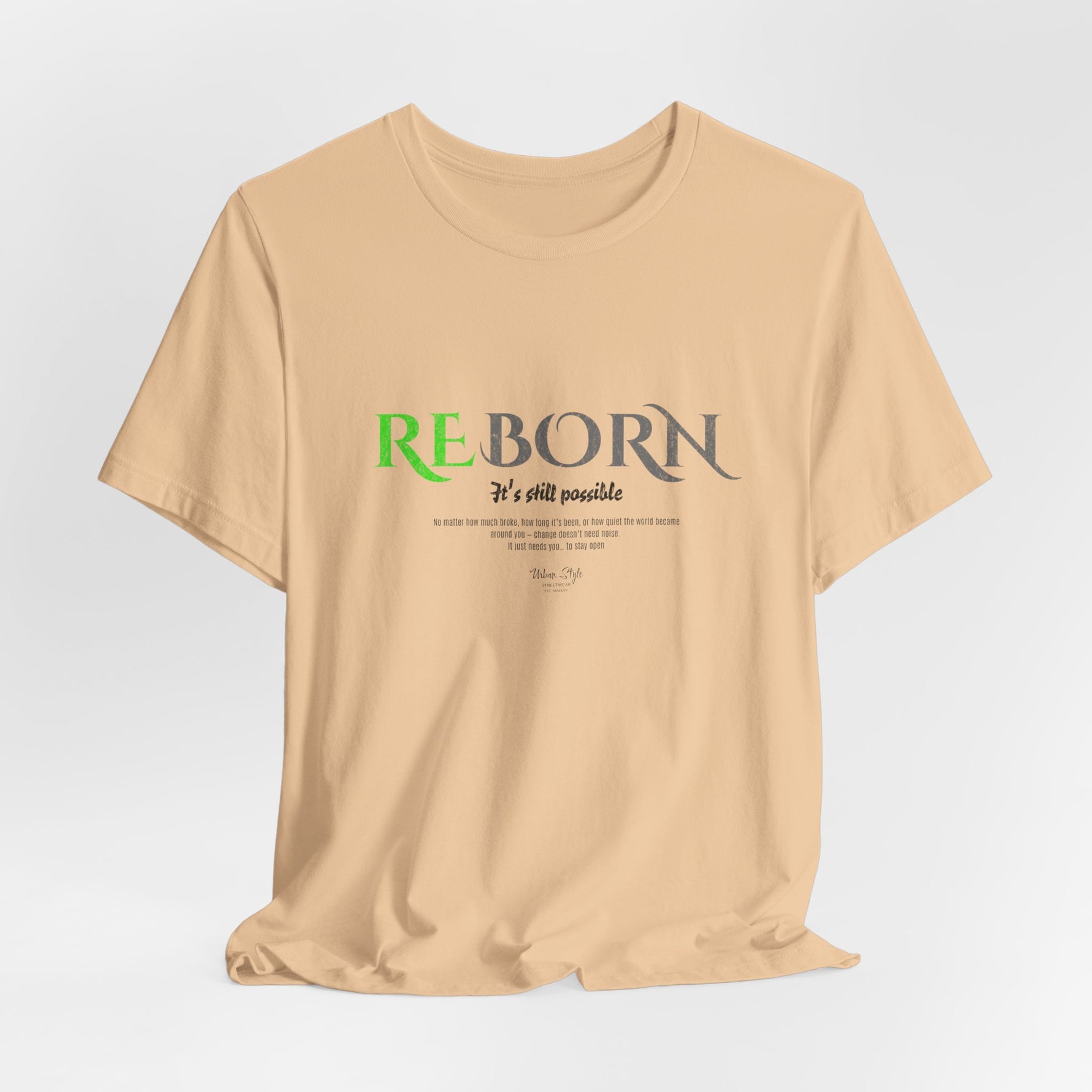 The REBORN t-shirt in Sand Dune — weathered change in soft endurance.