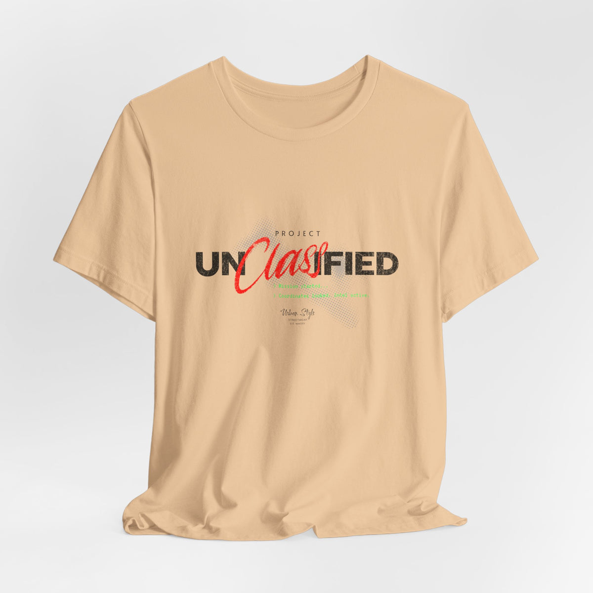 The PROJECT UNCLASSIFIED t-shirt in sanddune — 3D mockup of shirt in soft sand dune beige, no background, no model.