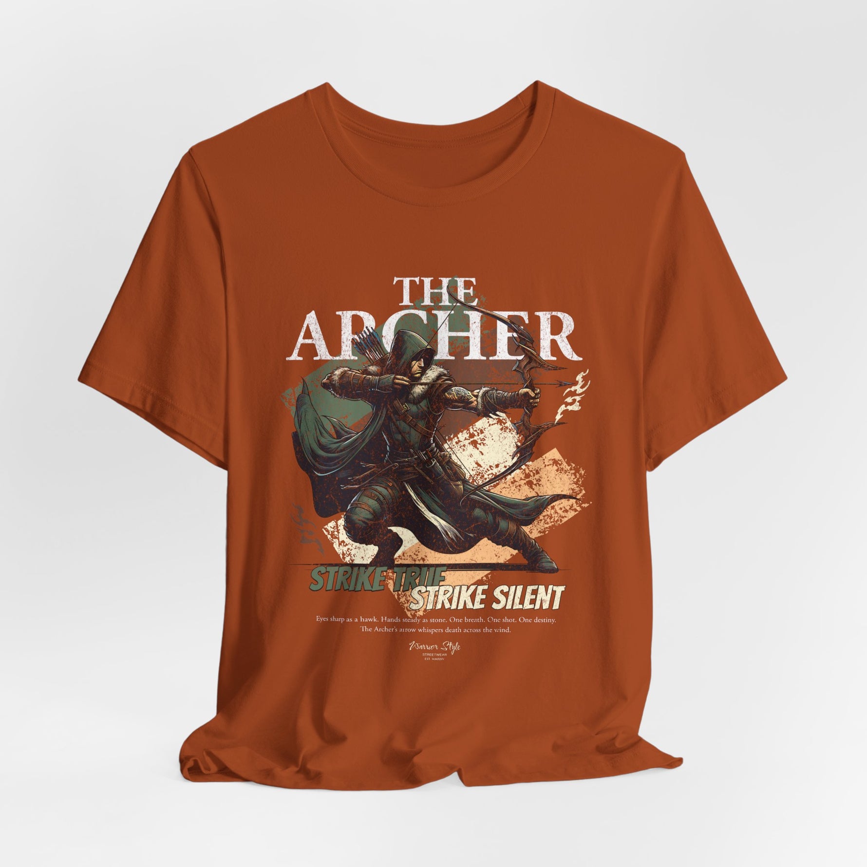 The ARCHER t-shirt in autumn — A forest-born whisper, sharpened in fallen leaves.