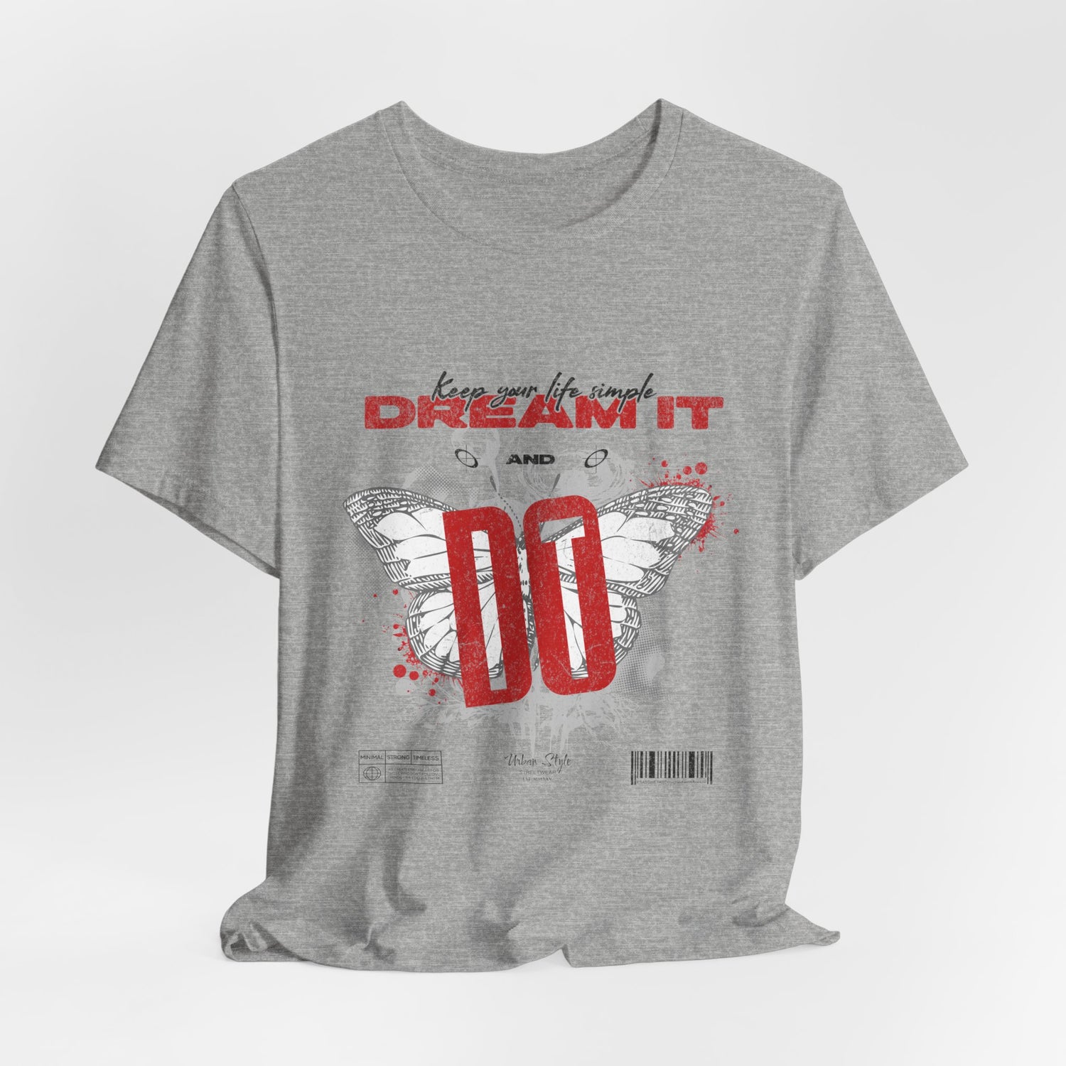 The DREAM IT DO IT t-shirt in Athletic Heather — light grey with a sporty texture, softens the bold message.