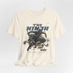 The NINJA t-shirt in Natural — like bare footsteps on stone — quiet and exact.