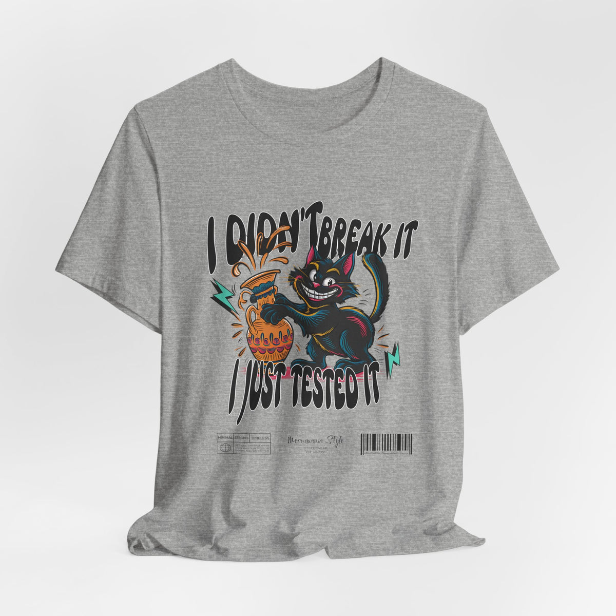 The I Just Tested It t-shirt in athletic heather — a light grey with a sporty finish that softens the high-energy graphic.