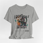 The I Just Tested It t-shirt in athletic heather — a light grey with a sporty finish that softens the high-energy graphic.