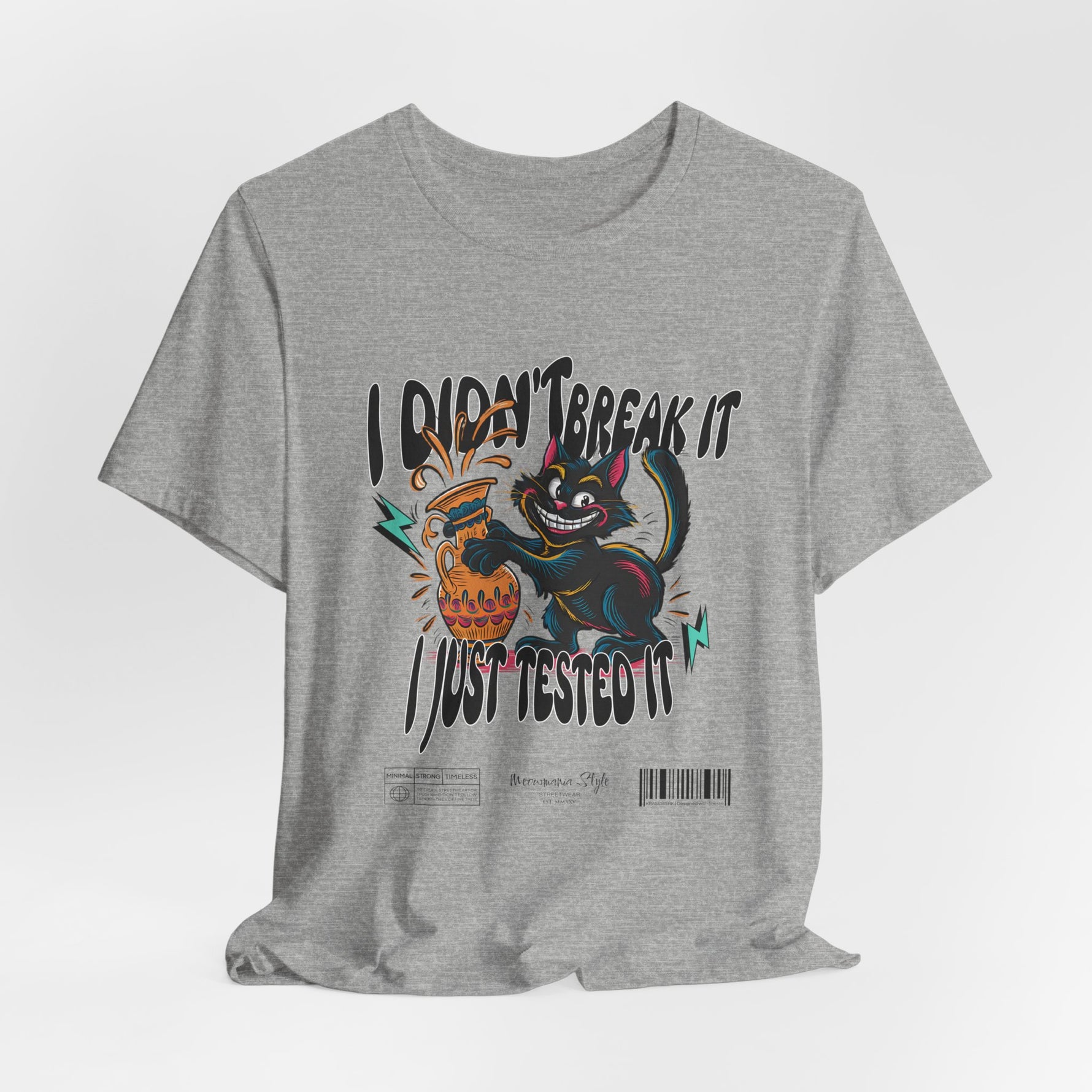 The I Just Tested It t-shirt in athletic heather — a light grey with a sporty finish that softens the high-energy graphic.