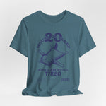 3D mockup of the “STILL TIRED” t-shirt in Heather Deep Teal — bluish-green blend with no background or model.