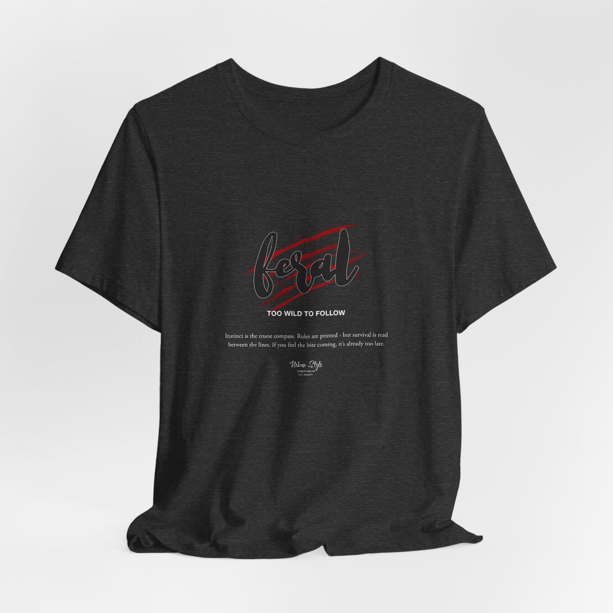 The FERAL t-shirt in Dark Heather Grey — survival isn’t printed. It’s wired in.