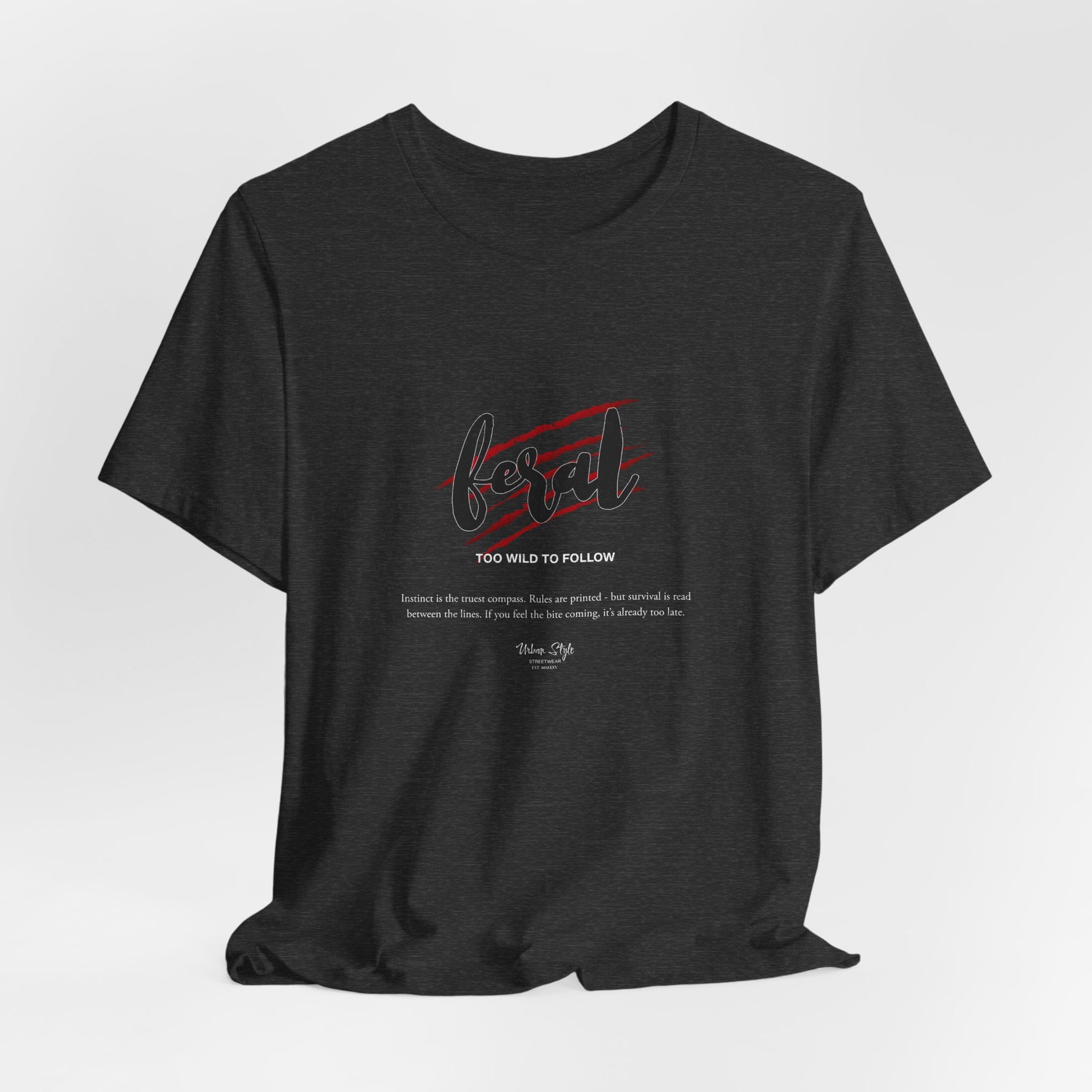 The FERAL t-shirt in Dark Heather Grey — survival isn’t printed. It’s wired in.