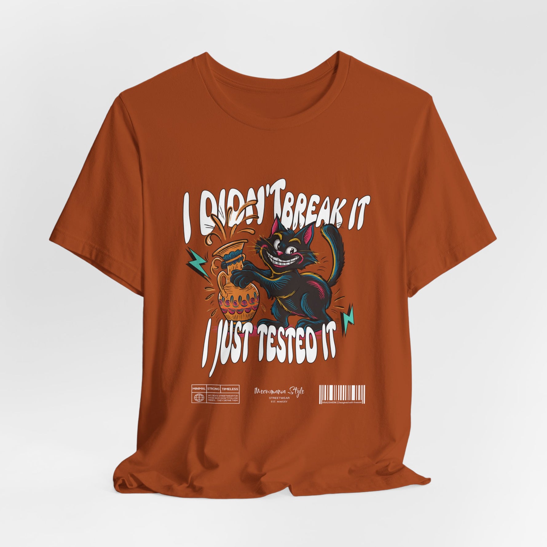 The I Just Tested It t-shirt in autumn — a warm, rusty orange that enhances the retro mischief vibe of the cat graphic.