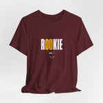 The ROOKIE t-shirt in Maroon — unsure footing, but a fire growing inside.
