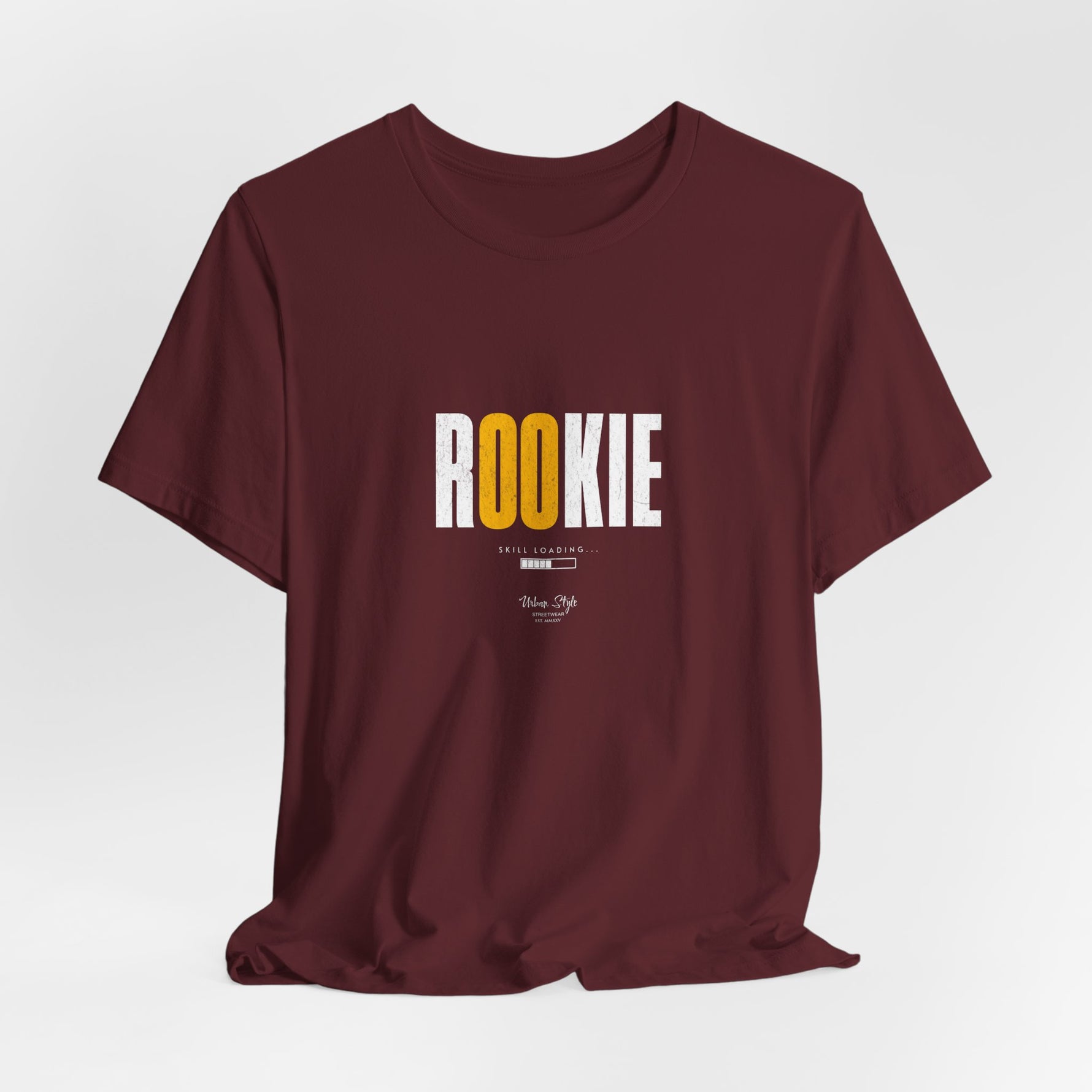 The ROOKIE t-shirt in Maroon — unsure footing, but a fire growing inside.