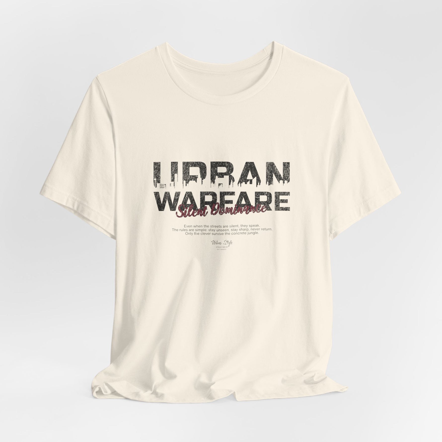 The URBAN WARFARE t-shirt in Natural — the quietest ones leave the deepest cracks.