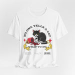 The No One Tells a Cat t-shirt in white — ghost mockup showing a clean bright white tone with no background or model.