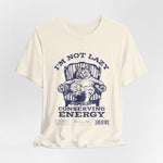 The I'M NOT LAZY t-shirt in Natural — soft neutral tone suits the vintage blue print.