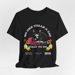 The No One Tells a Cat t-shirt in black — ghost mockup showing a deep black fabric tone with no background or model.