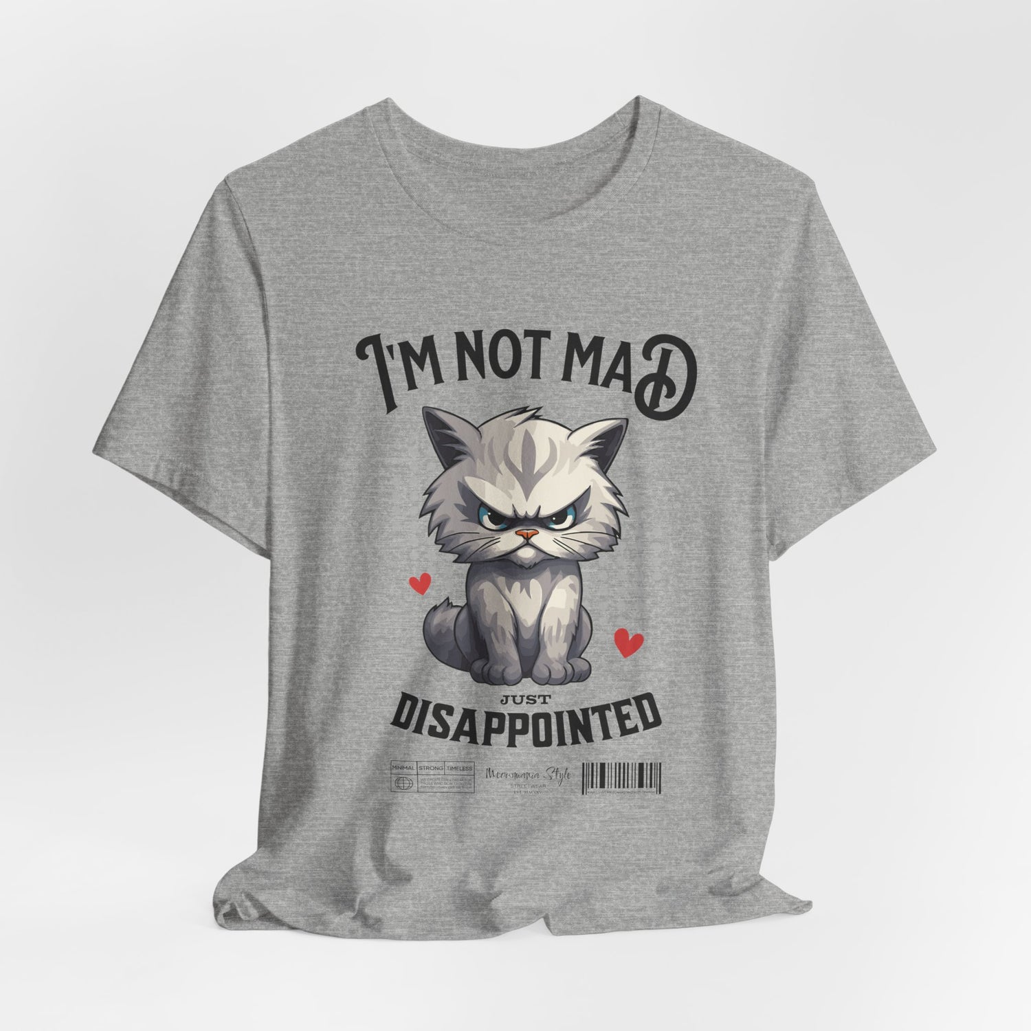 The NOT MAD t-shirt in Athletic Heather — 3D mockup of a light grey shirt; shown on a blank stage.