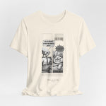 The CARDIO t-shirt in Natural — 3D mockup of the creamy off-white Natural color. Alien and cat comic printed at chest. Model-free.