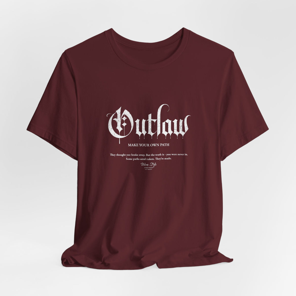 The OUTLAW t-shirt in Maroon — slow-burn strength that never asked permission.