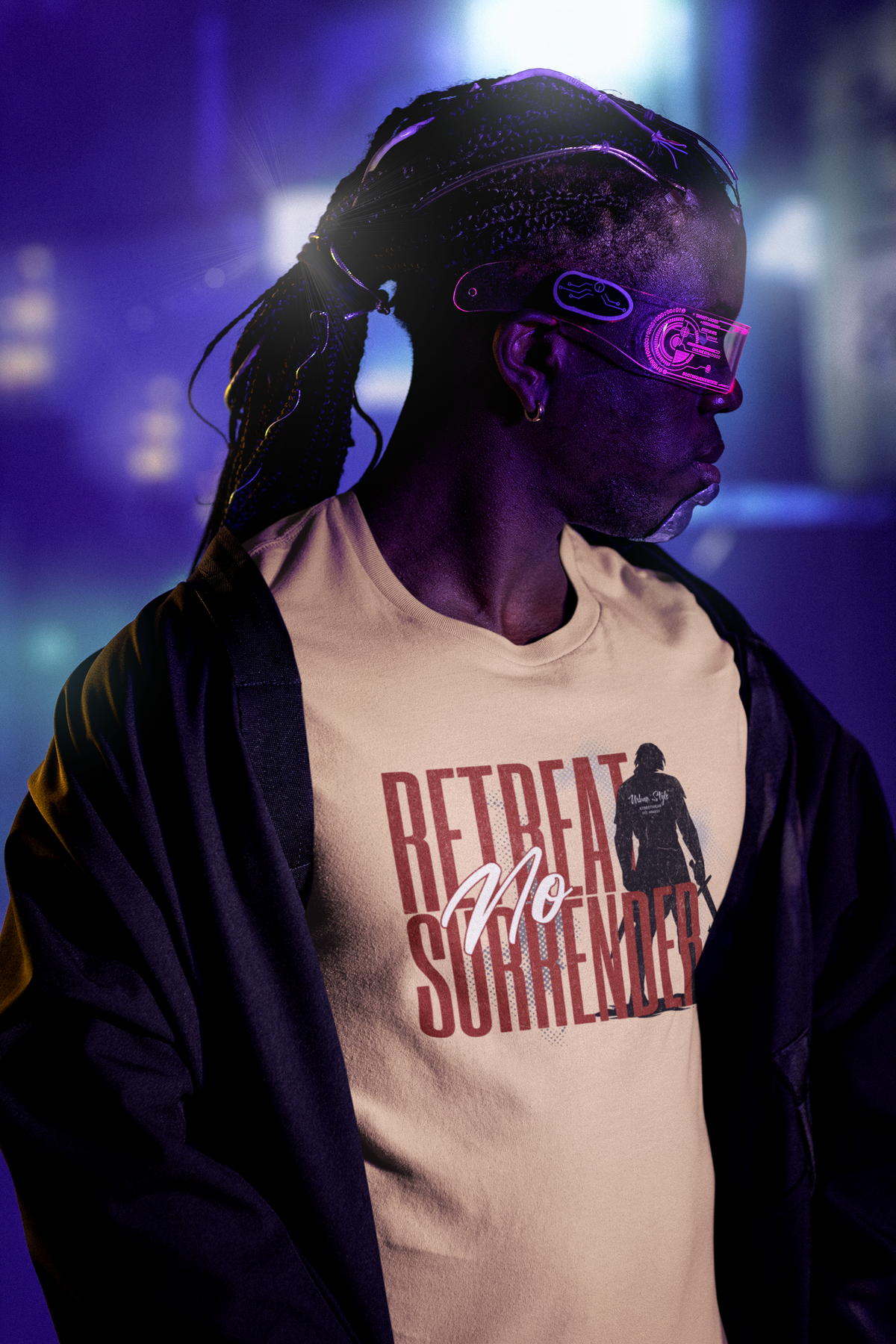 “No Retreat No Surrender” sanddune tee by KRASSWERK – worn by male model in cyberpunk setting with neon lights, futuristic visor, and confident side pose