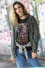 “Where Is My Coffee?” white tee by KRASSWERK – worn by female model in street-style setting with grunge backdrop, zombie graphic and casual layering
