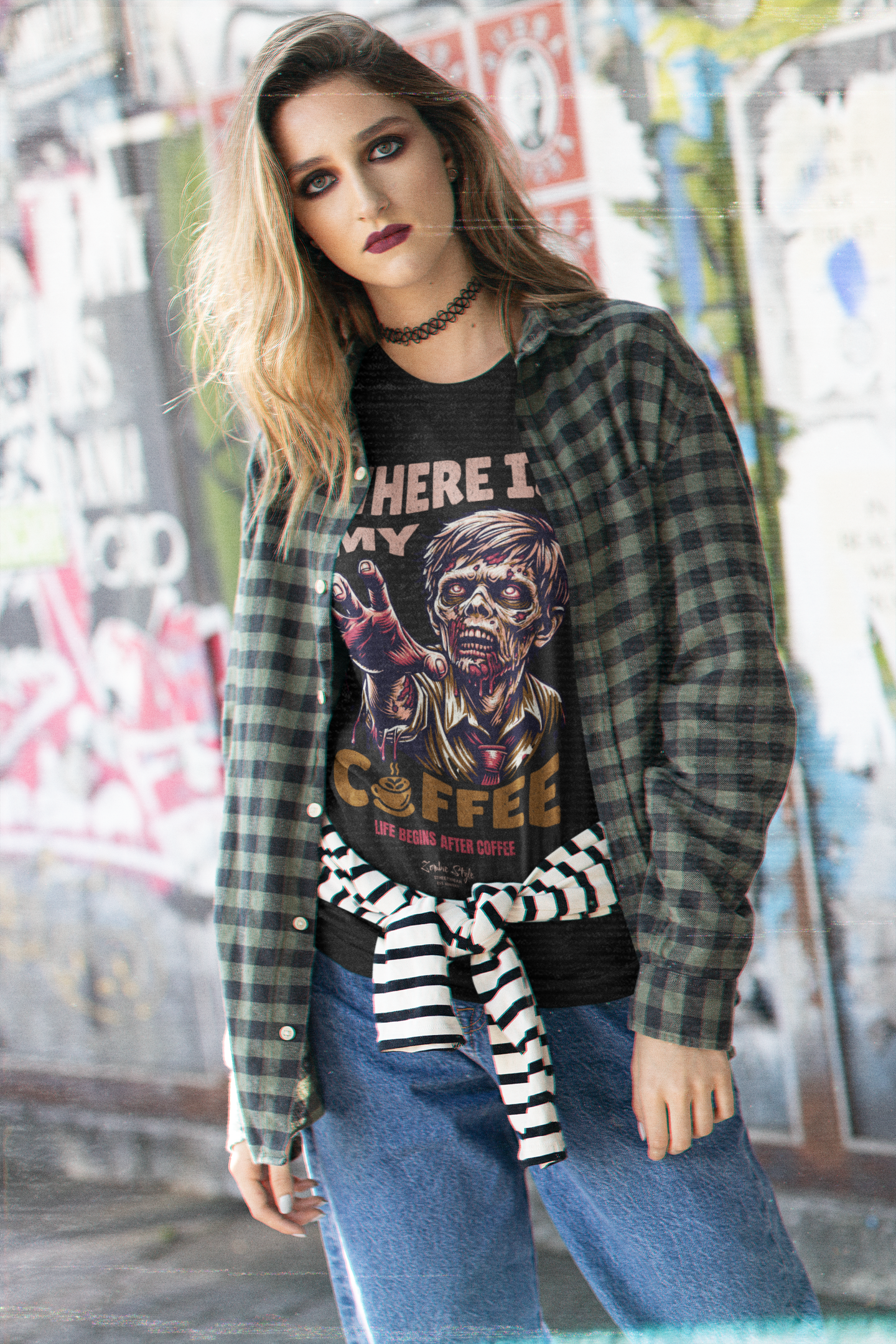 “Where Is My Coffee?” white tee by KRASSWERK – worn by female model in street-style setting with grunge backdrop, zombie graphic and casual layering
