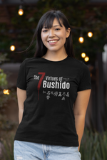 The 7 Virtues of Bushido black tee by KRASSWERK – worn by female model in evening outdoor setting with warm lights, balanced smile and soft contrast