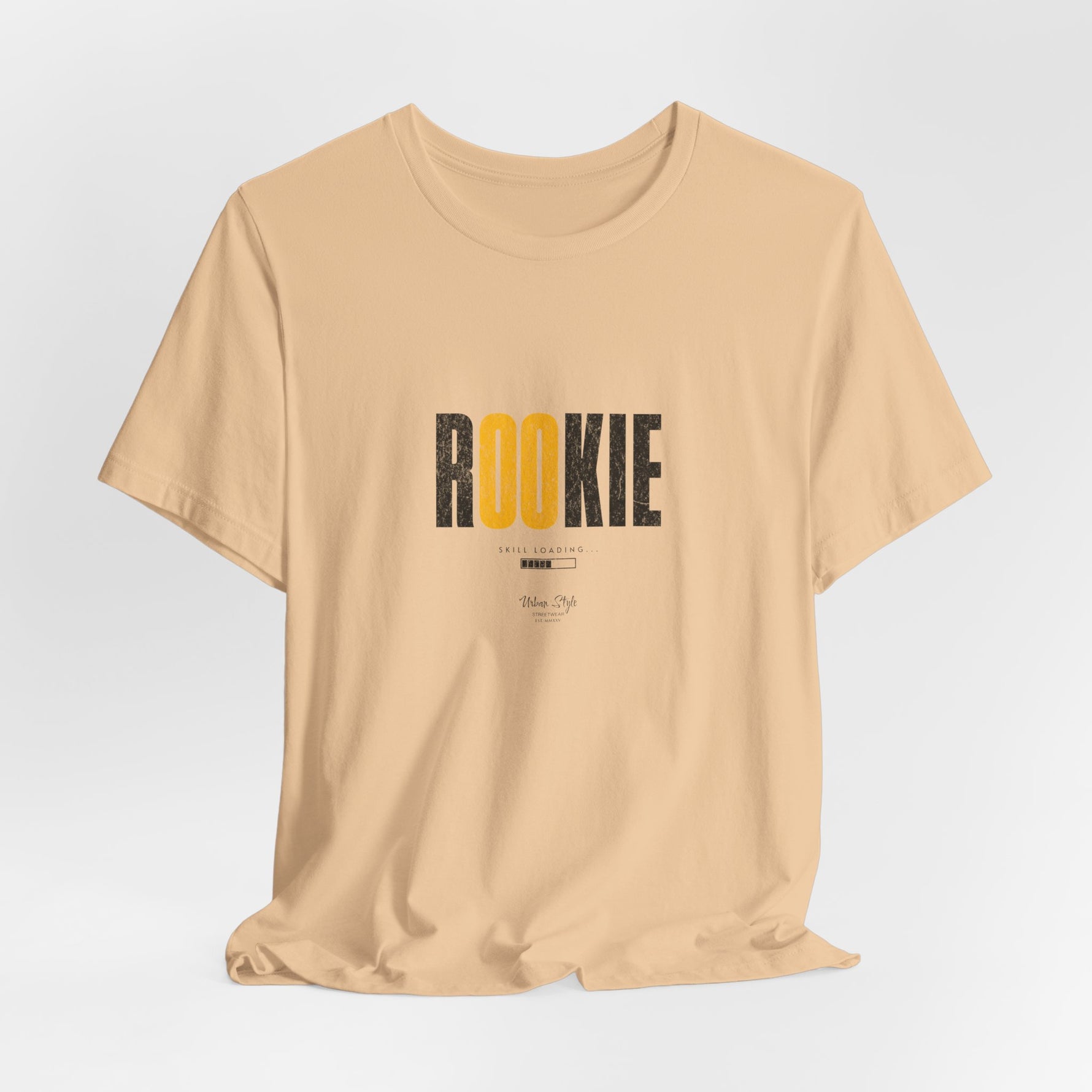 The ROOKIE t-shirt in Sand Dune — fresh boots in shifting ground.