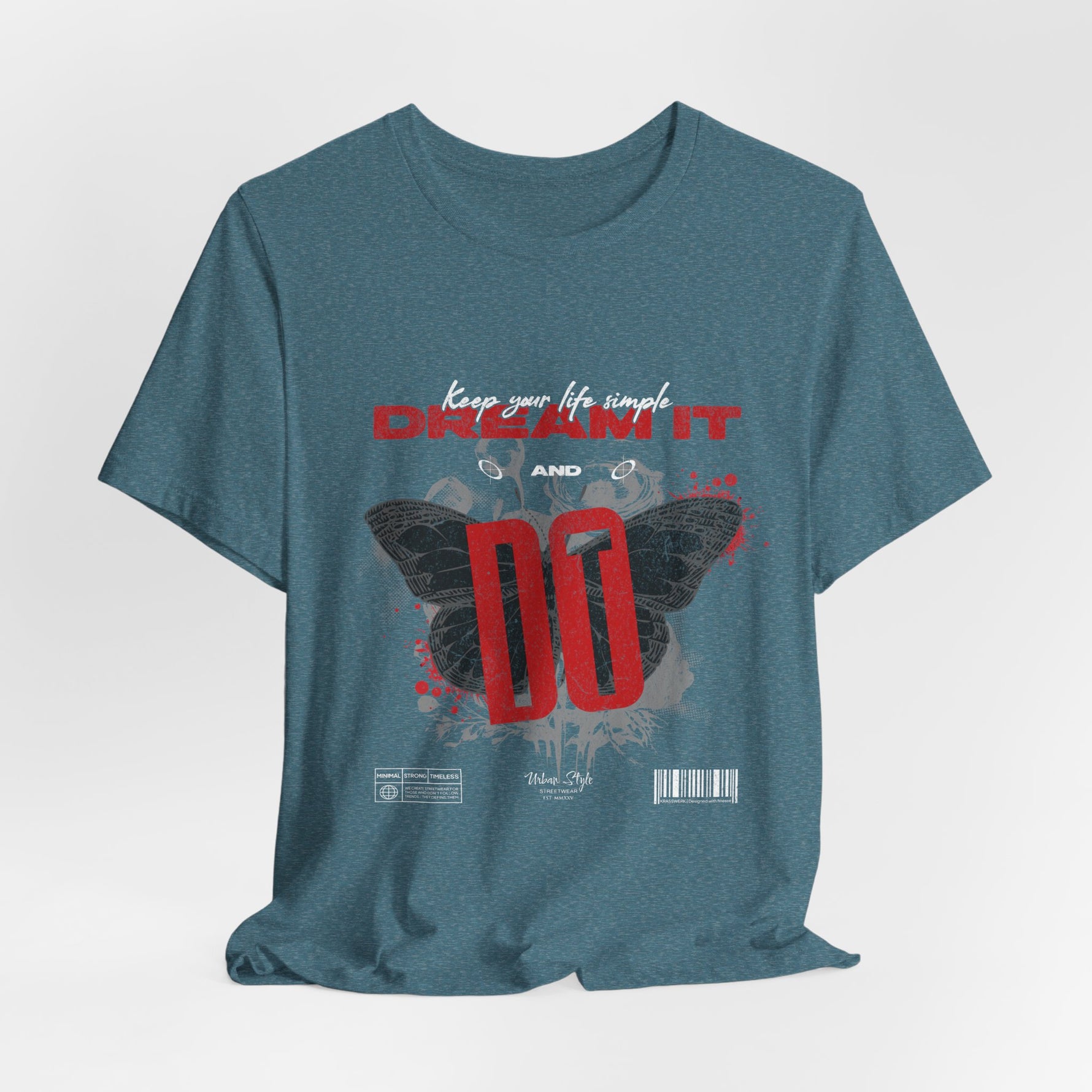 The DREAM IT DO IT t-shirt in Heather Deep Teal — moody teal base, giving depth to the red and white contrast.