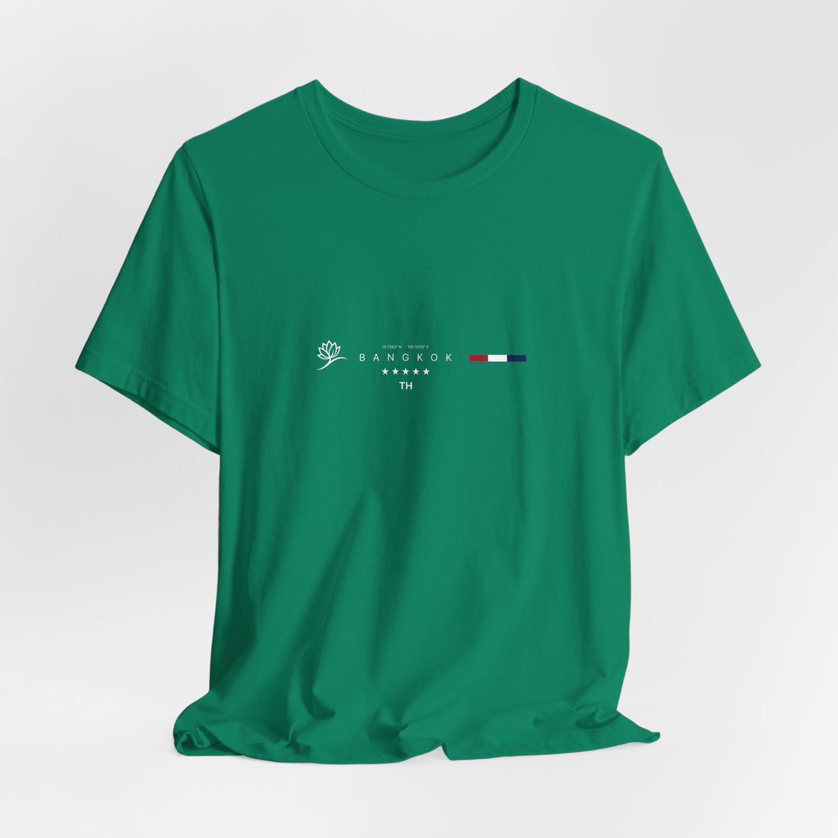The BANGKOK t-shirt in Kelly — a vivid green that echoes the lush tones of Bangkok’s tropical flora.