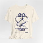 3D mockup of the “STILL TIRED” t-shirt in Natural — soft off-white tone with no background or model.