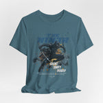 The NINJA t-shirt in Heather Deep Teal — the stillness before a storm breaks.