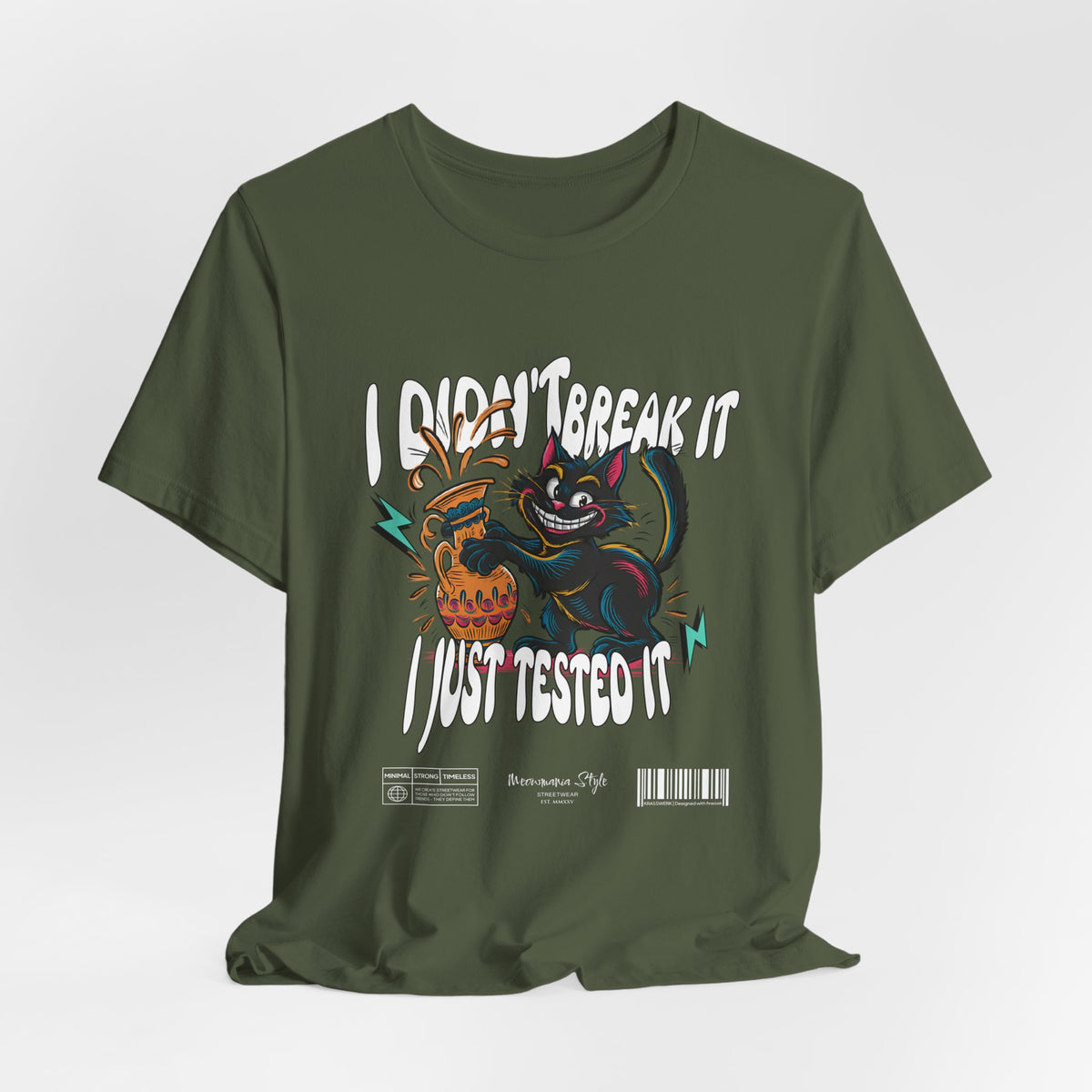 The I Just Tested It t-shirt in military green — a gritty, tactical green that adds a rough charm to the playful destruction.