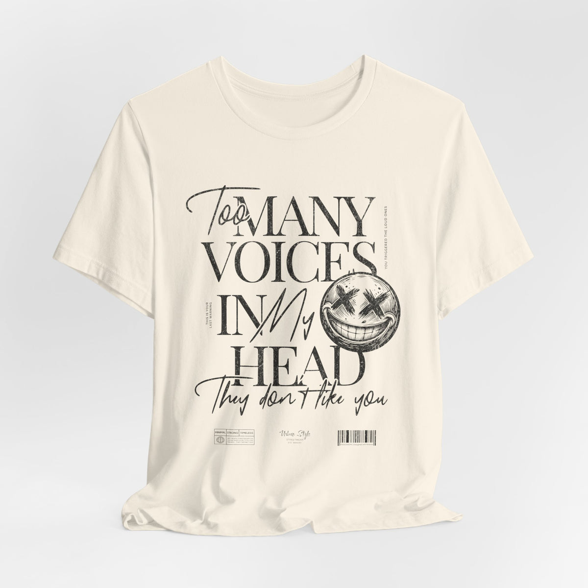 The MANY VOICES t-shirt in Natural — A soft disguise for sharp thoughts.