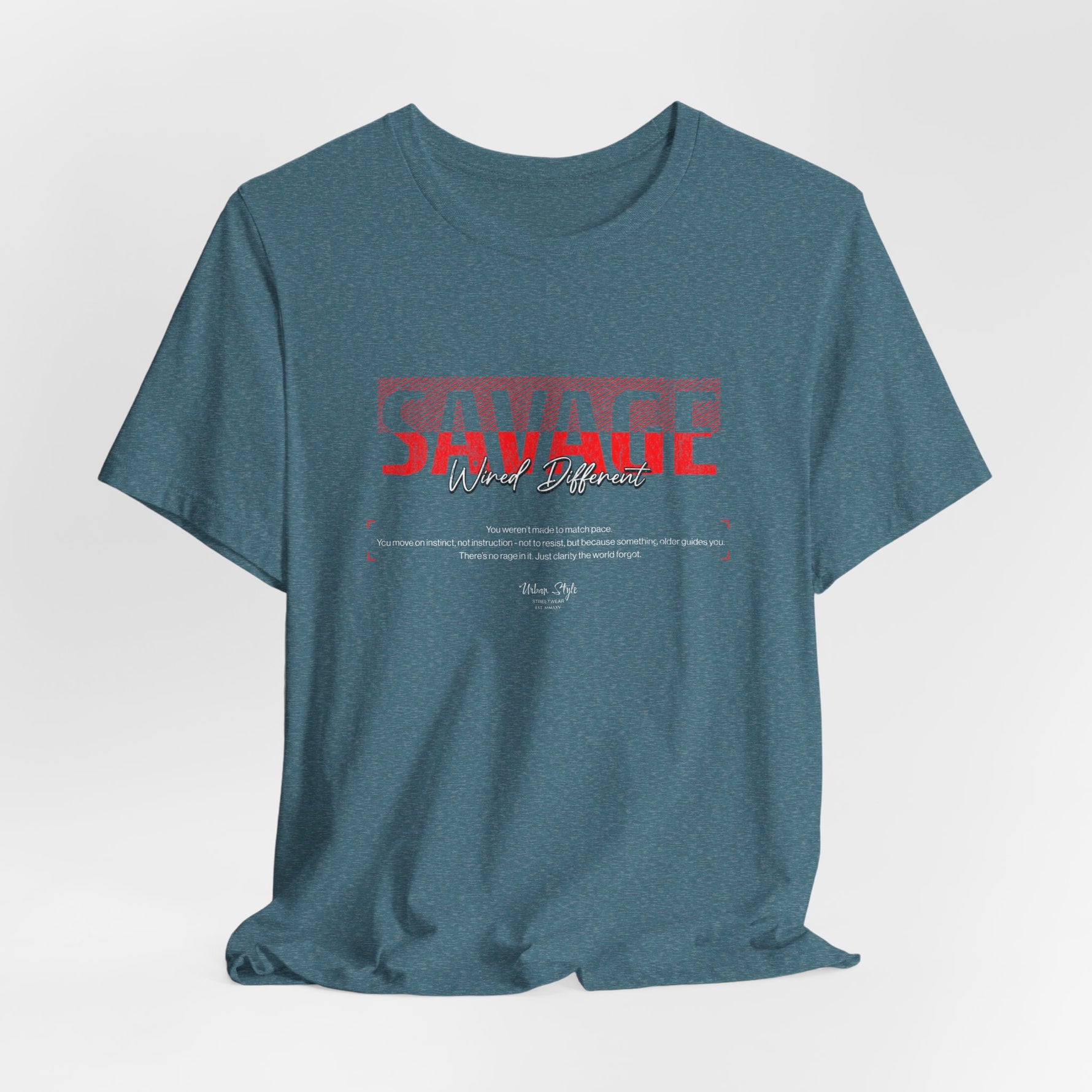 The SAVAGE t-shirt in Heather Deep Teal — ocean-deep instinct. No map, just motion.