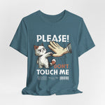 The PLEASE! DON’T TOUCH ME t-shirt in Heather Deep Teal — calm and distant, the polite version of “no.”