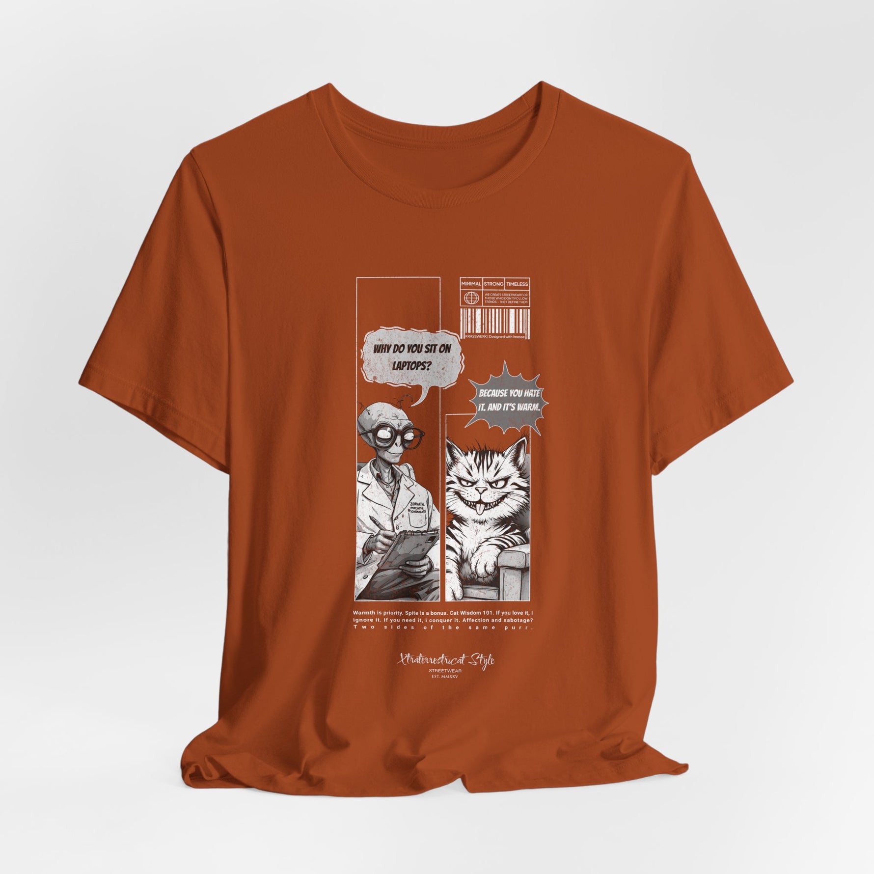 The SITONLAPTOPS t-shirt in Autumn — 3D mockup on a warm burnt-orange shirt, no model, no background. Comic artwork pops with contrast.