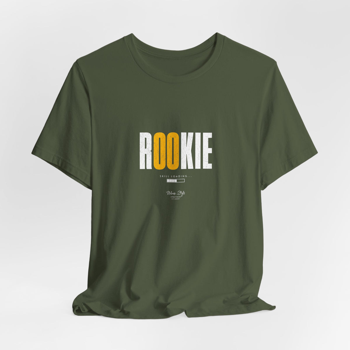 The ROOKIE t-shirt in Military Green — alert, clumsy, and trying to look tough.