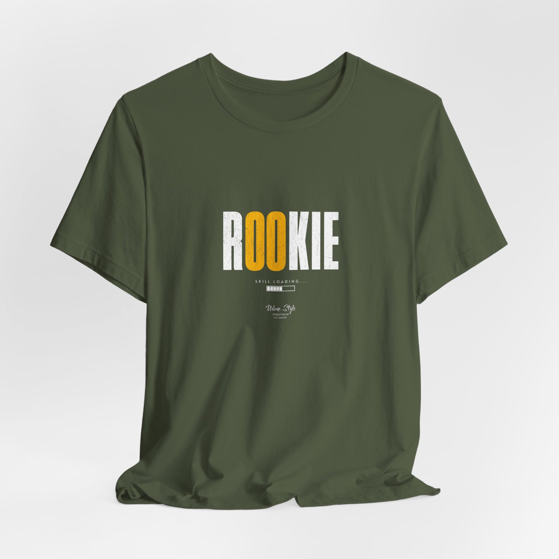 The ROOKIE t-shirt in Military Green — alert, clumsy, and trying to look tough.