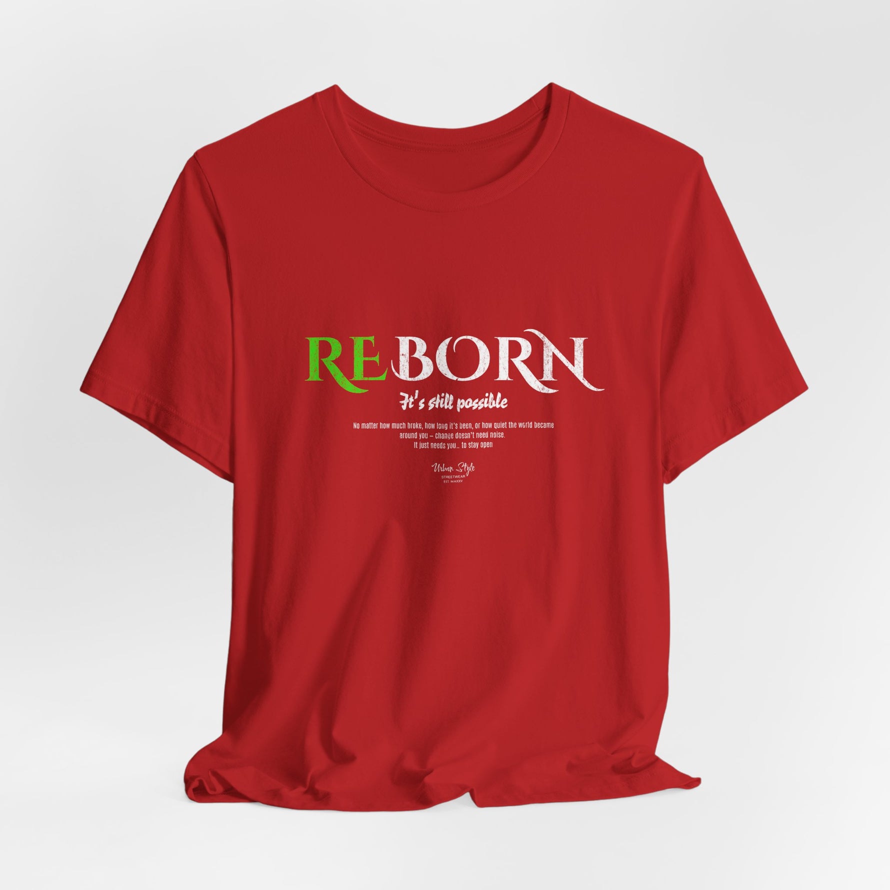 The REBORN t-shirt in Red — scars ignited, but not defined, by fire.
