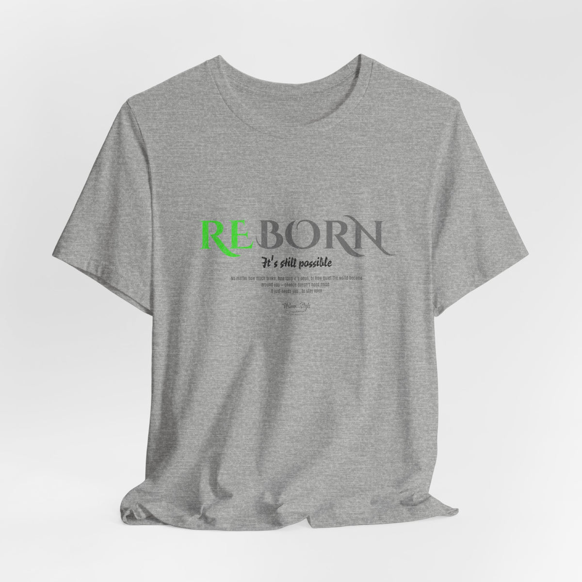 The REBORN t-shirt in Athletic Heather — soft exterior, unshakable core.