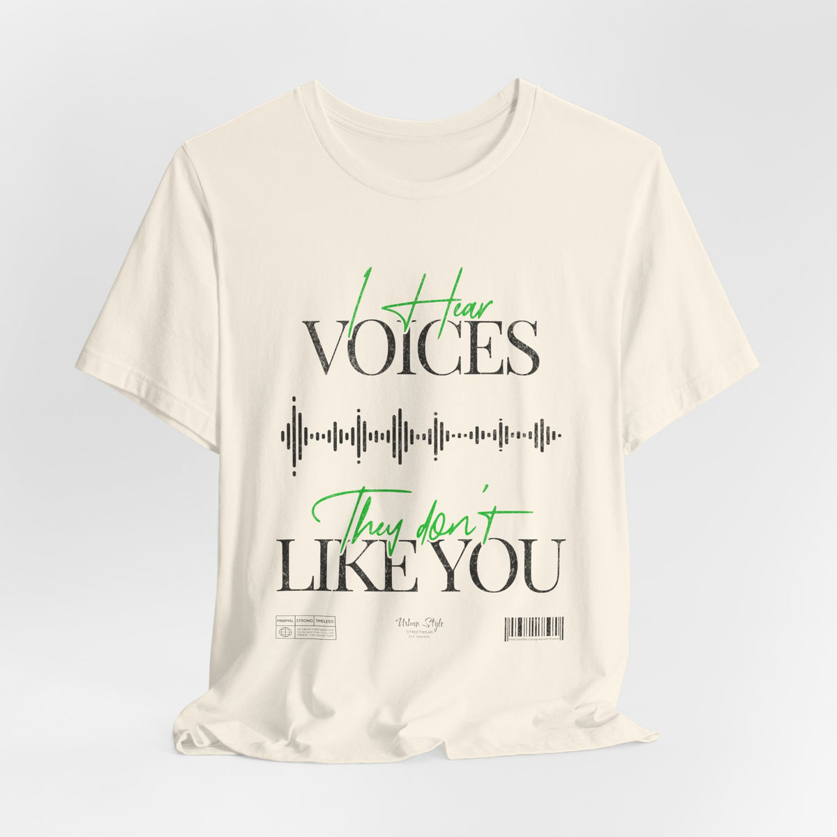 The VOICES t-shirt in Natural — the unsettling calm of thoughts that sound like truth.